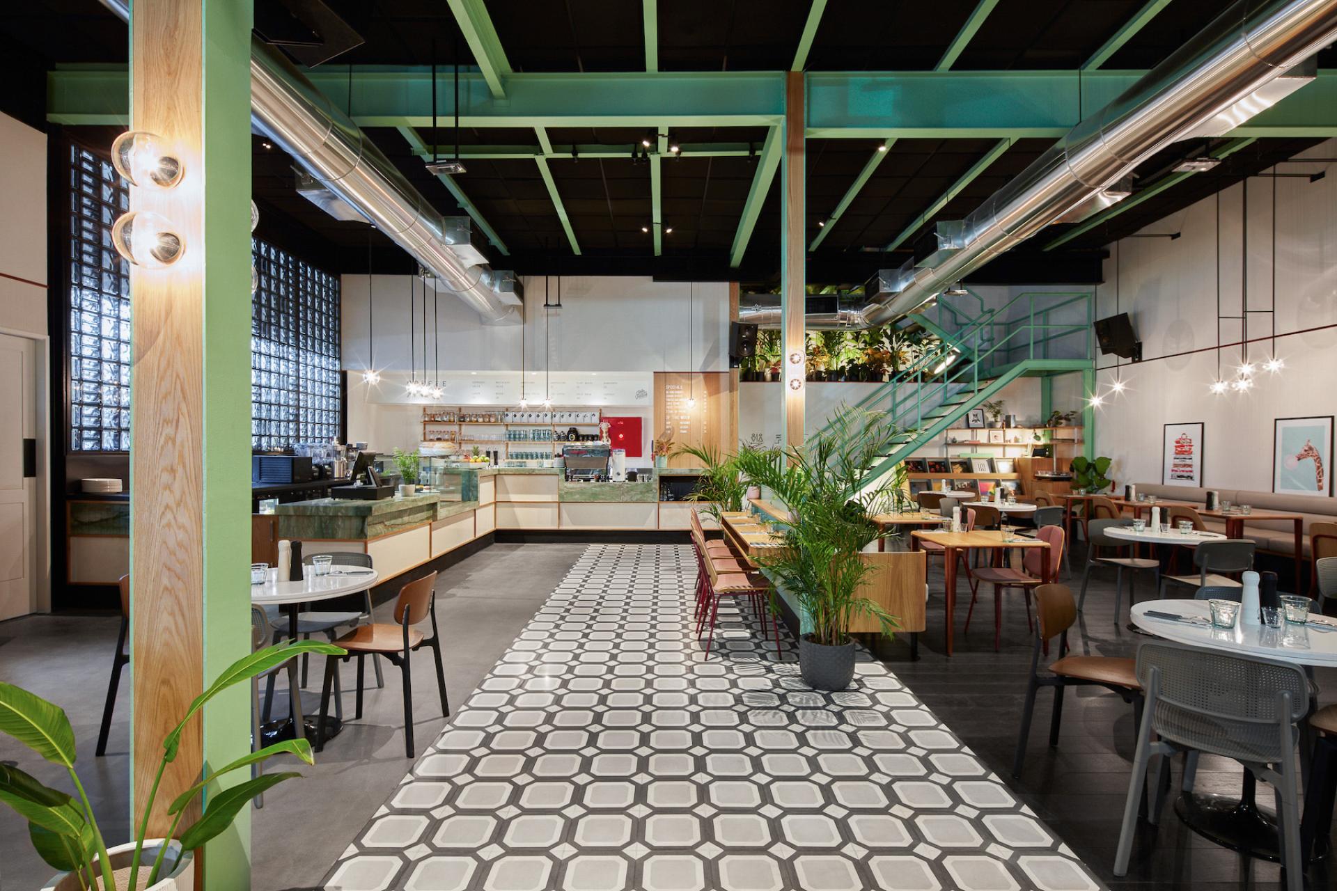 Modern café interior featuring a stylish design, natural elements, and vibrant decor representing Dubai's café culture.