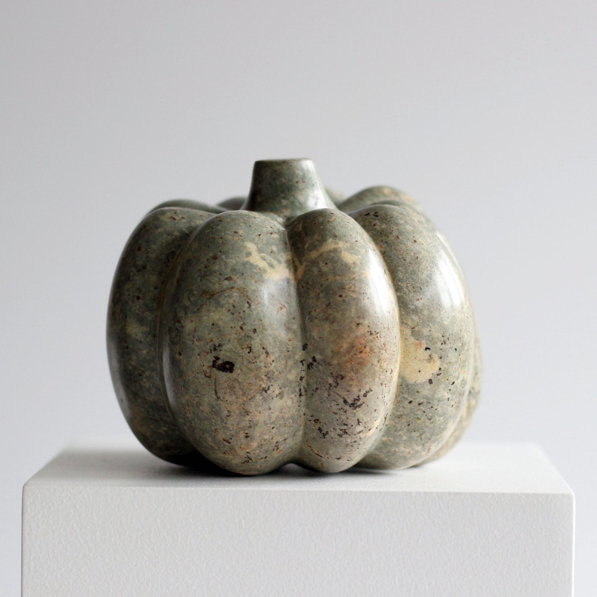 Sculptural stone vase shaped like a pumpkin, displayed at the Great Northern Contemporary Craft Fair in Manchester.