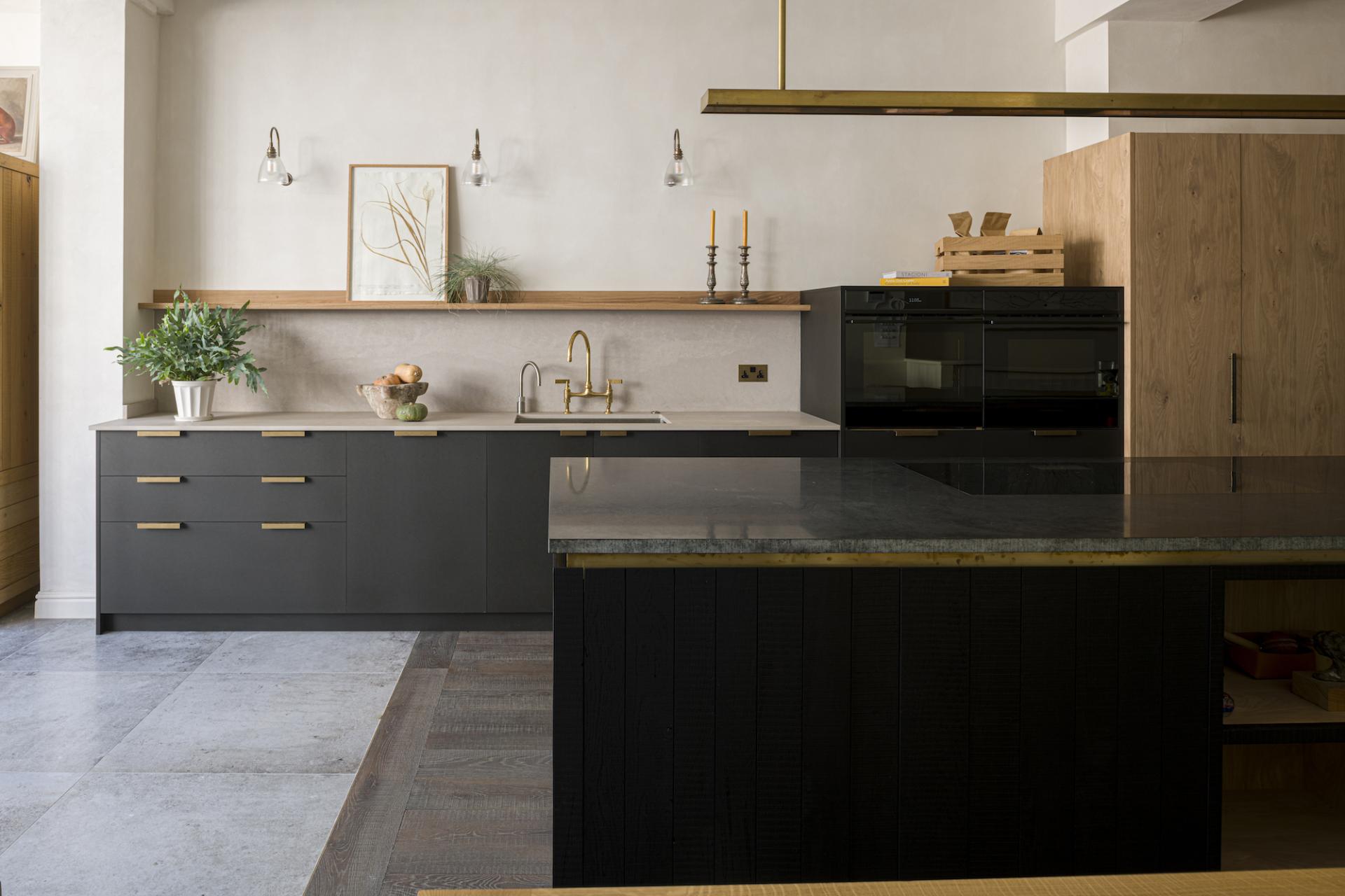 Modern kitchen design featuring Caesarstone countertops, wooden cabinetry, and stylish decor elements in a bright, inviting space.