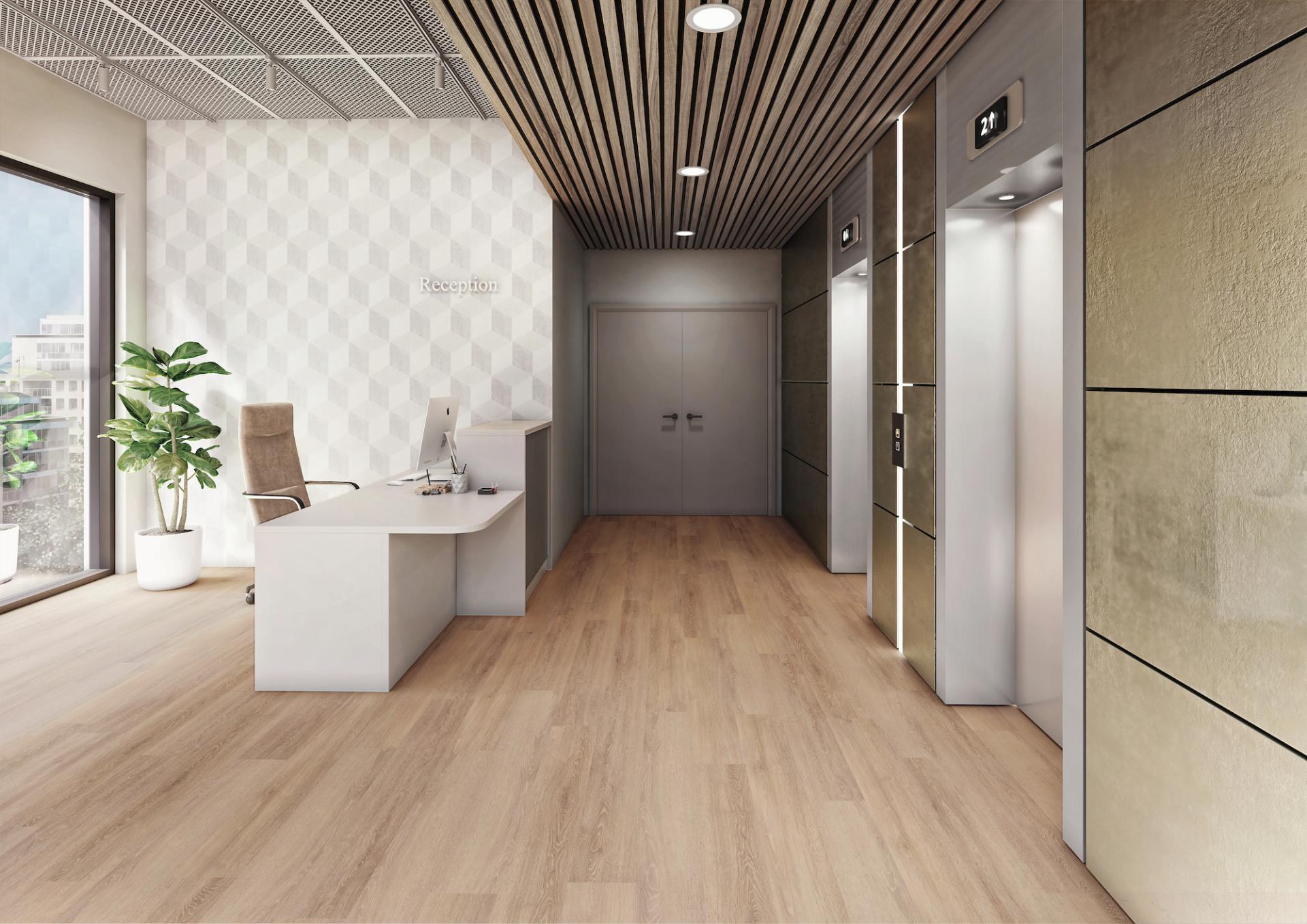 Modern reception area featuring Amtico safety flooring, a sleek desk, elevators, and stylish decor enhancing commercial aesthetics.