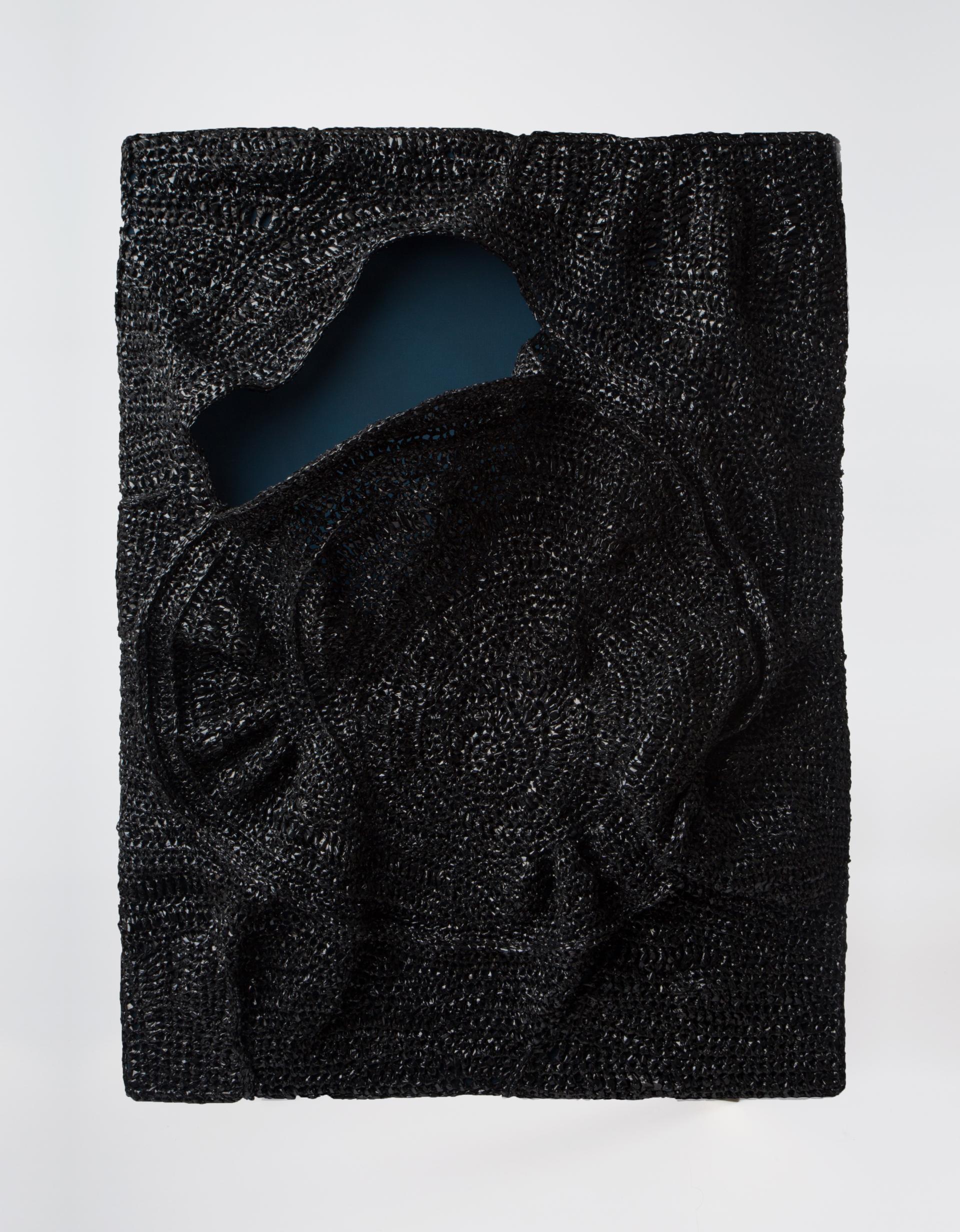 Textured black surface art piece with an abstract design, featured in the Surface Design Show 2020 in London.