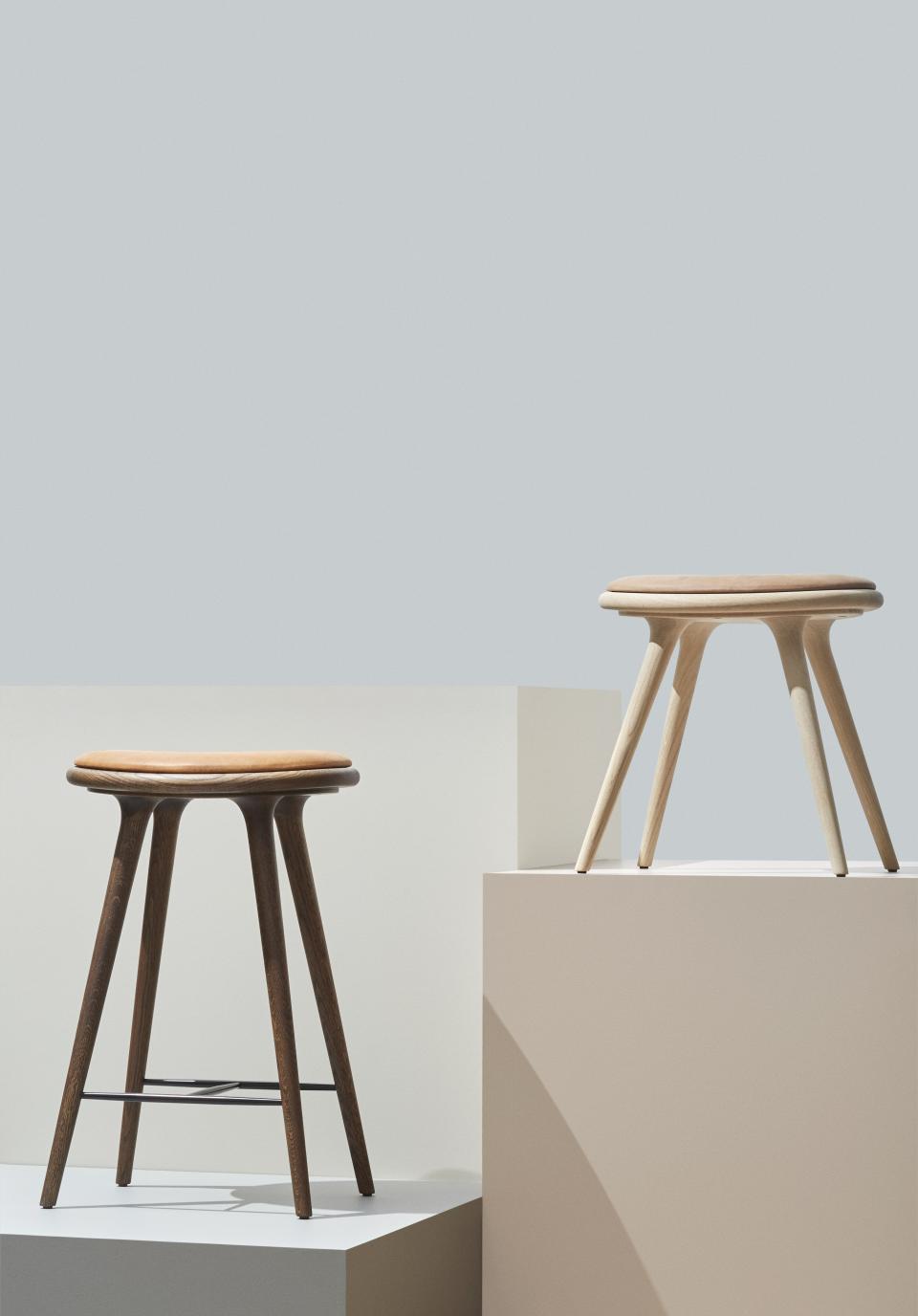 Newly launched wooden stools by Mater, designed by Space Copenhagen, showcasing elegant craftsmanship at Salone del Mobile 2019.