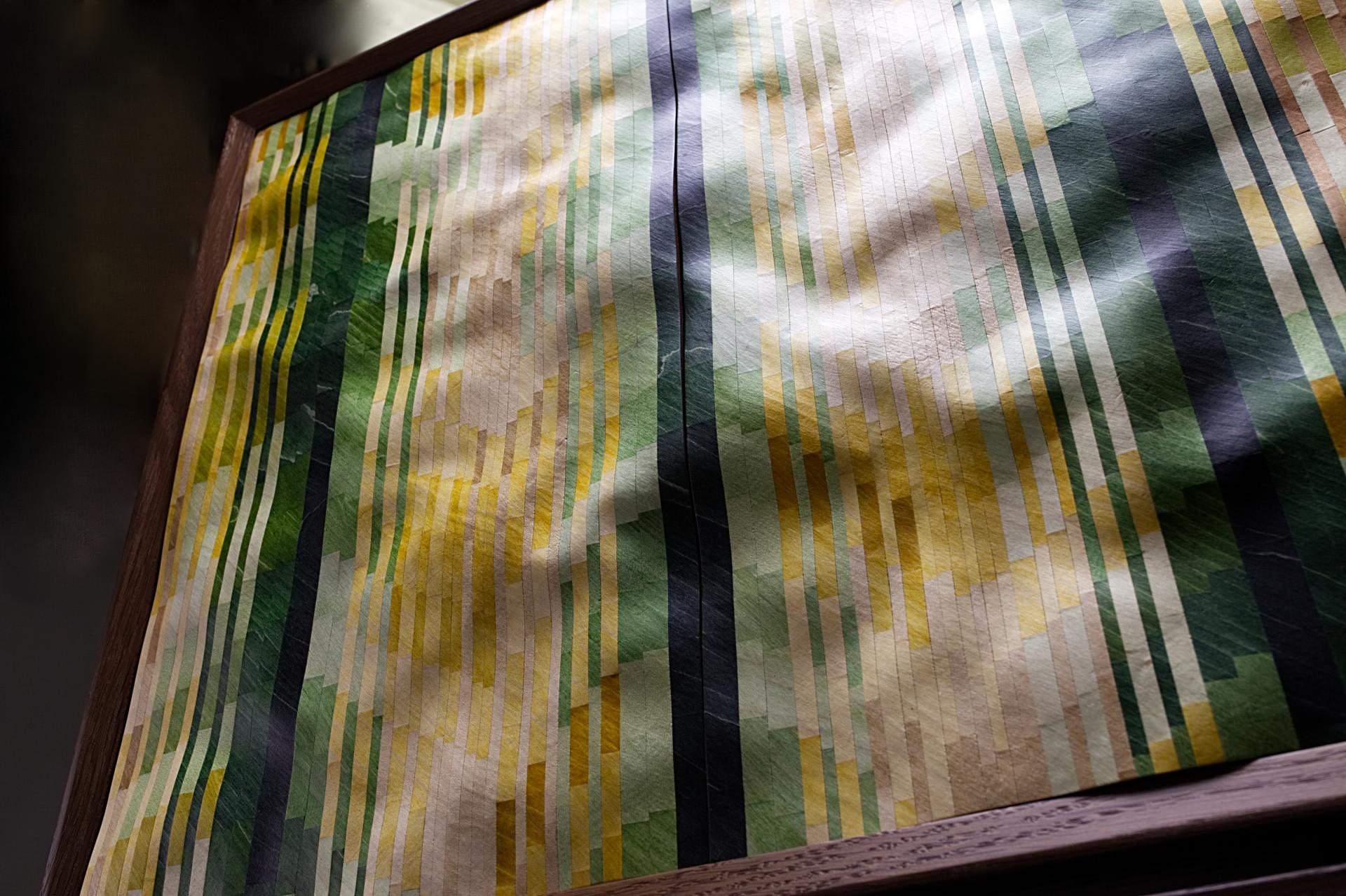 Colorful geometric patterns on wallpaper, showcasing Kevin Stamper's innovative design inspired by Madeira's natural landscapes.