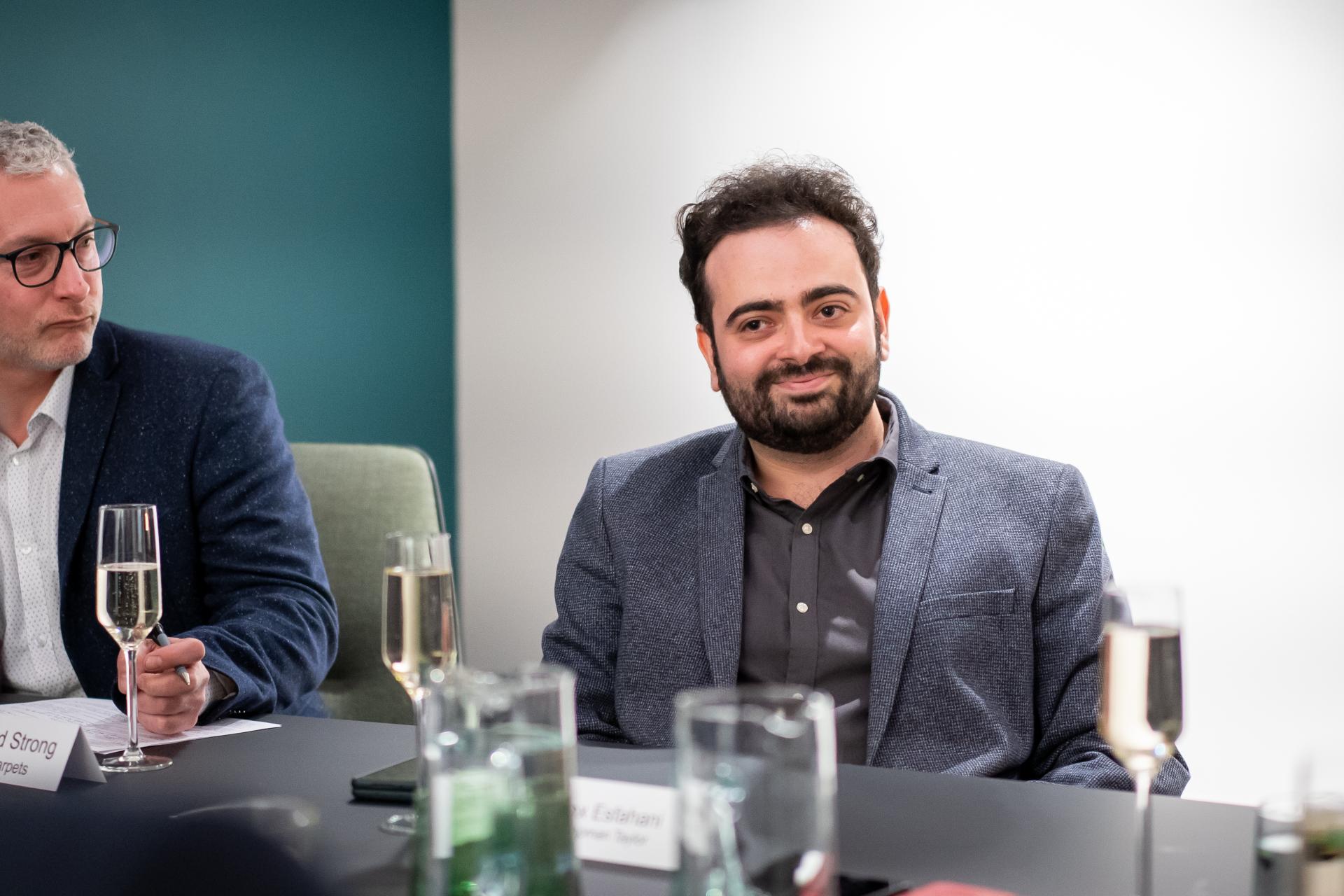 Participants engaged in a sustainability seminar discussion, highlighting themes of confusion and action in environmental efforts.