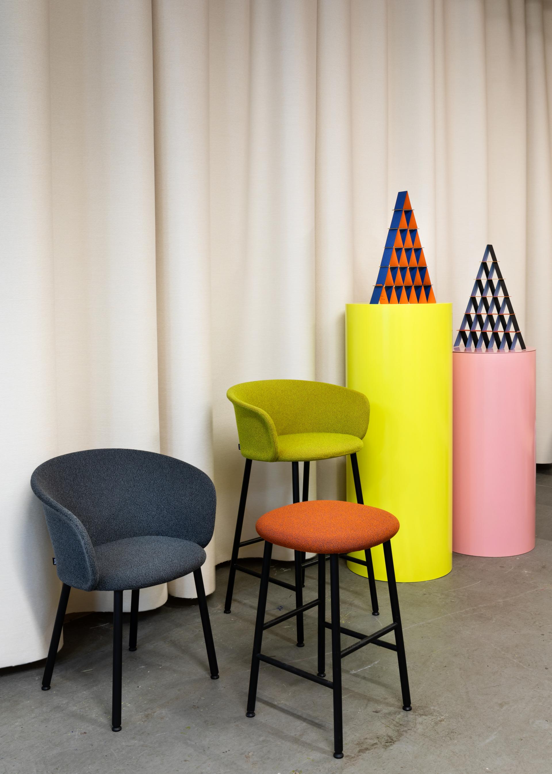 Stylish seating by Hem, showcasing colorful chairs and stools against a minimalist backdrop at LDF19 in Shoreditch.