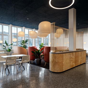 Modern office interior designed by Studio Gessaga, featuring stylish seating, plants, and ample natural light.