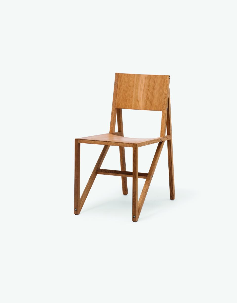 Contemporary wooden chair design by Established & Sons, showcasing minimalist aesthetics and functional craftsmanship in modern furniture.
