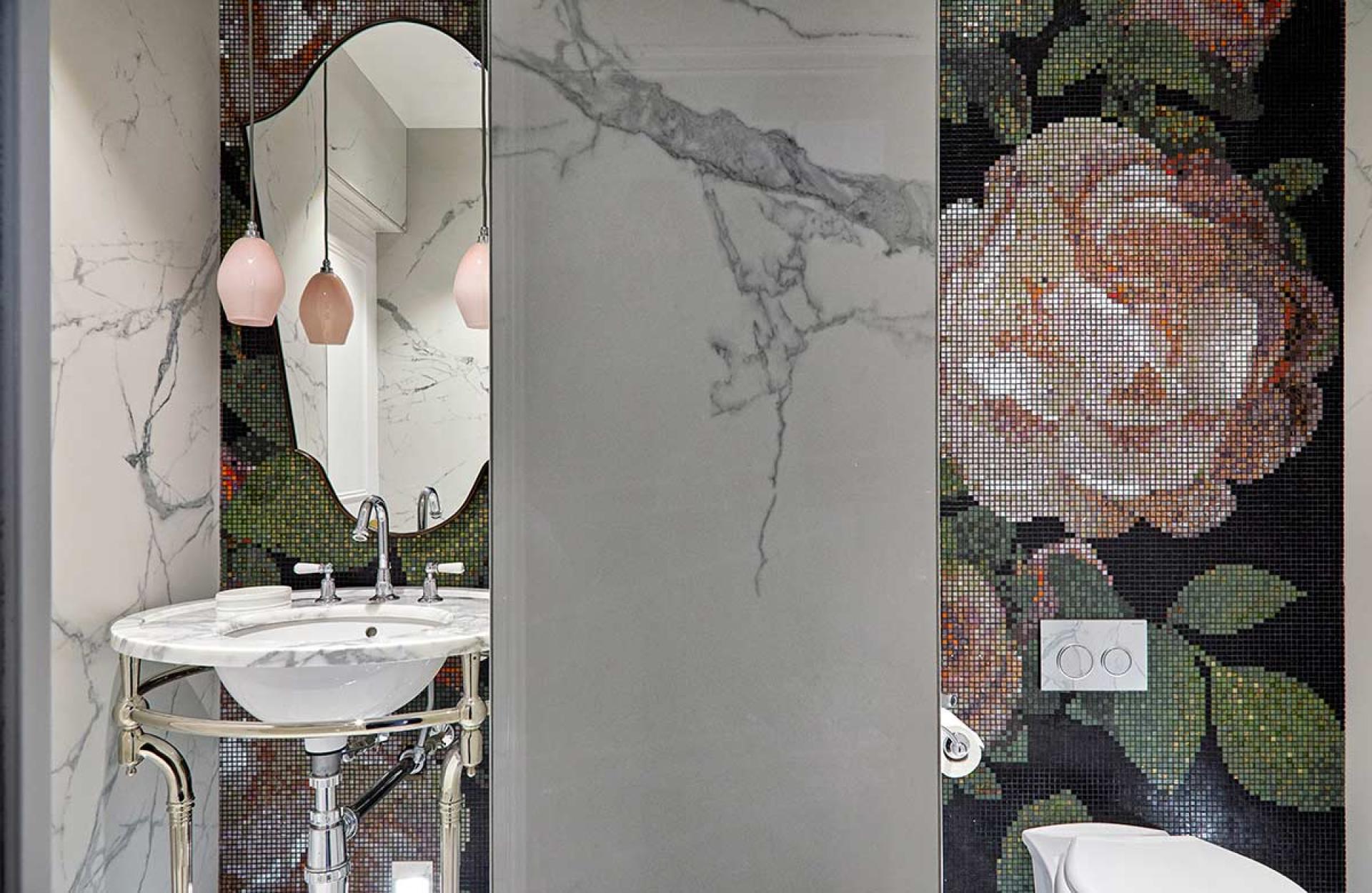 Luxurious bathroom featuring marble finishes, a stylish sink, and a vibrant floral mosaic, inspired by Van Gogh's art.