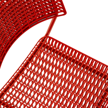 Stylish red CALA chair by Martin Ballendat, showcasing a modern design with a functional, stackable structure.