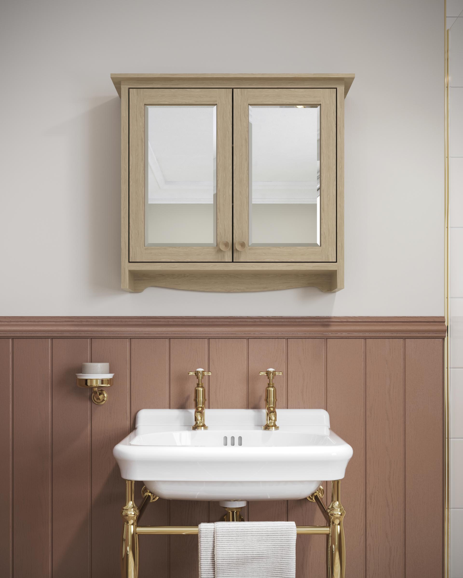 Elegant bathroom sink with brass fixtures and a wooden cabinet, showcasing Arts & Crafts design influences.