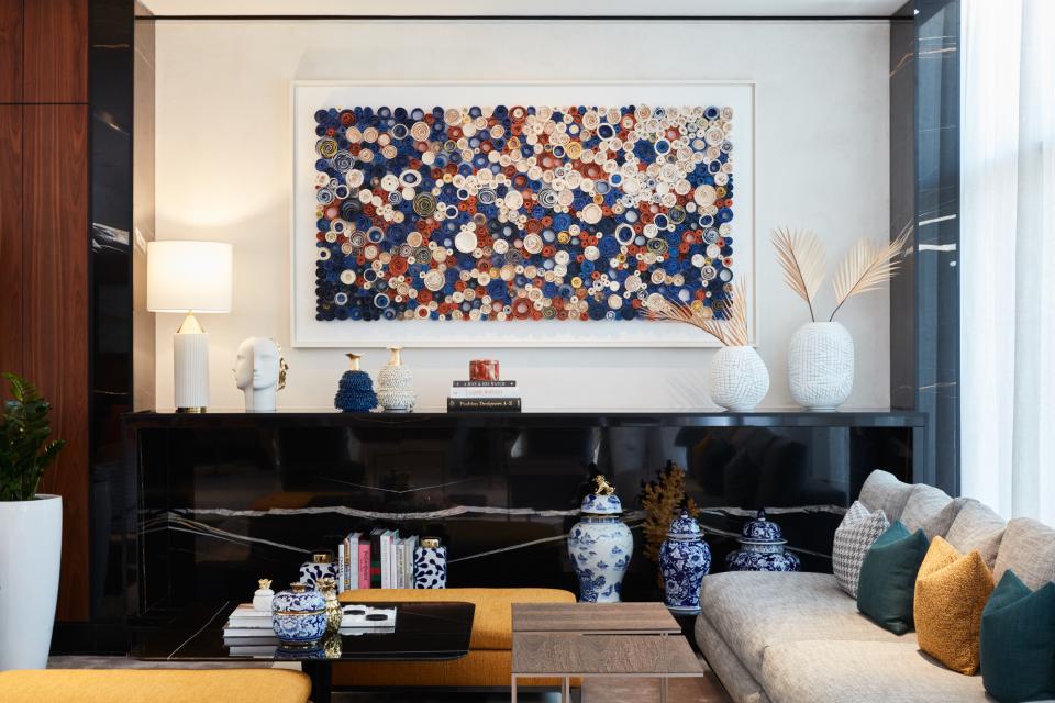 Contemporary art installation featuring colorful circular patterns, enhancing the modern interior design of The8 Hotel, Dubai.