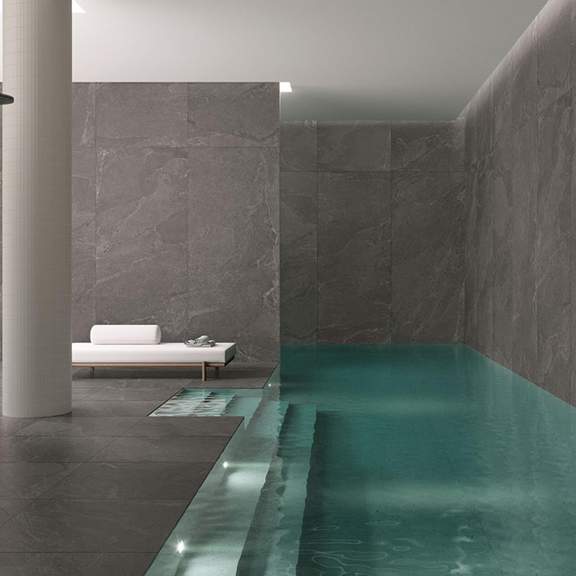 Luxurious interior featuring Grestec's Cellan collection of slate-inspired tiles and a serene pool area.