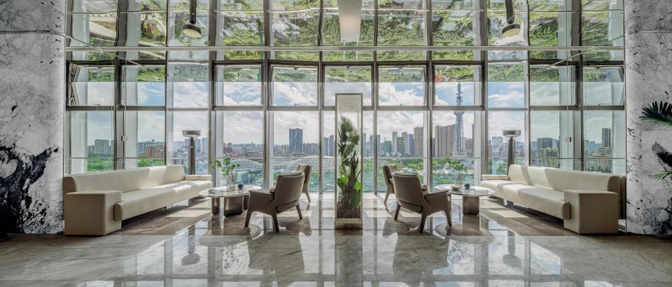 Modern interior design at Foshan Vanke Financial Centre featuring sleek furniture and expansive city views.