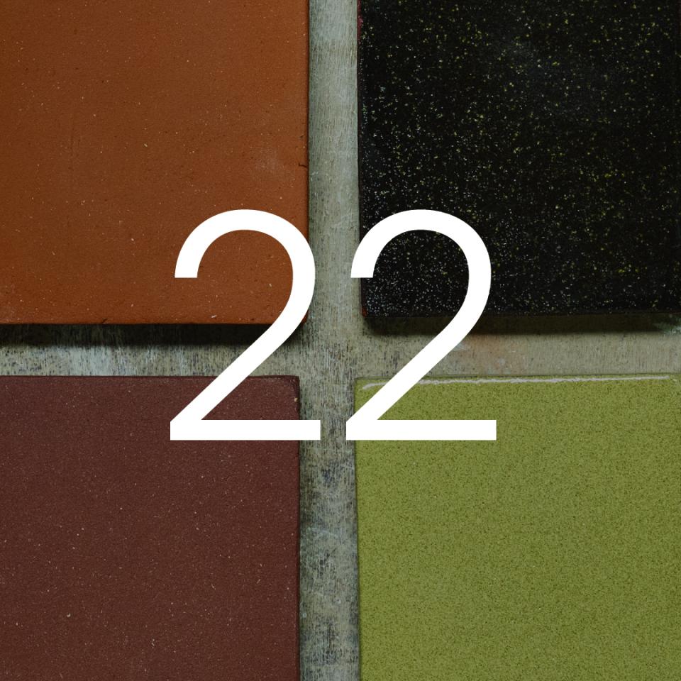 Colorful ceramic tiles representing the London Underground, featuring shades of red, green, and black with the number 22.