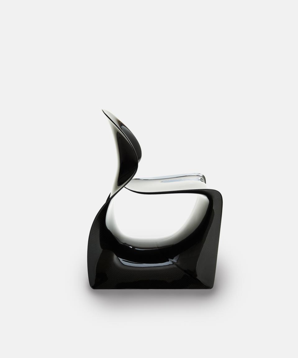 Sleek, contemporary black and clear chair showcasing innovative design from Established & Sons' latest seating collection.