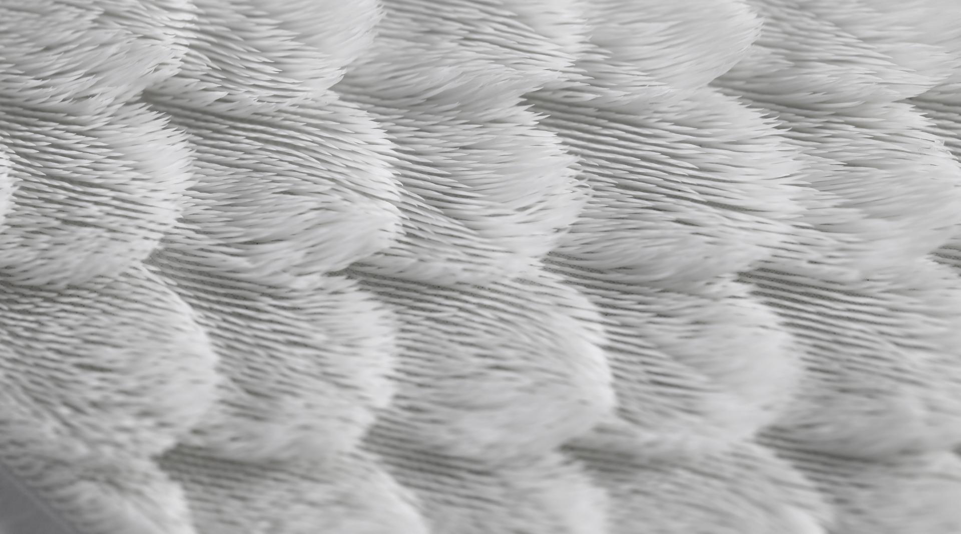 Close-up view of an innovative textile showcasing intricate textures, highlighting new materials in design and product development.