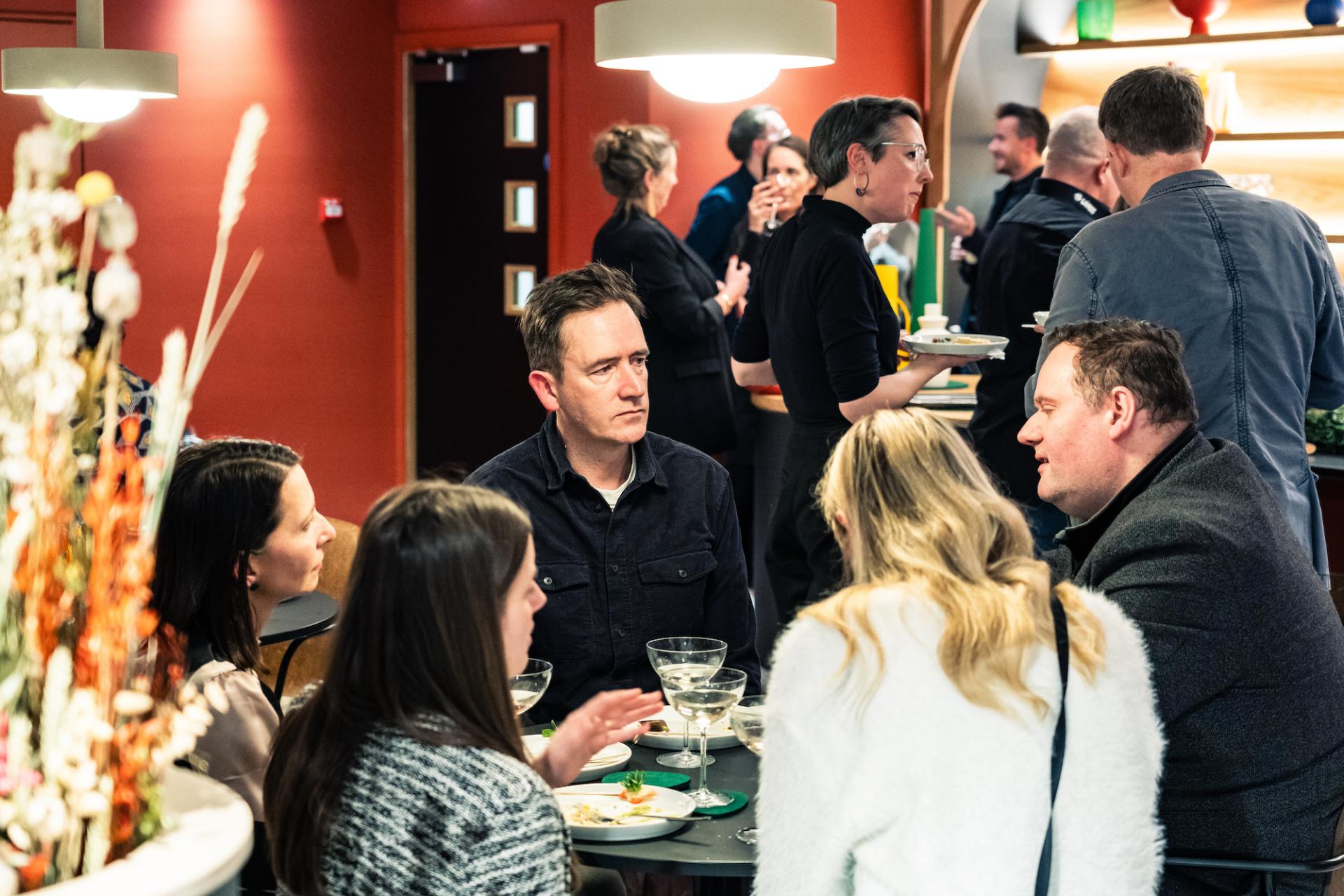 Guests engaging in conversation at the In Conversation event with designer Anna Campbell-Jones at Material Source Studio Glasgow.