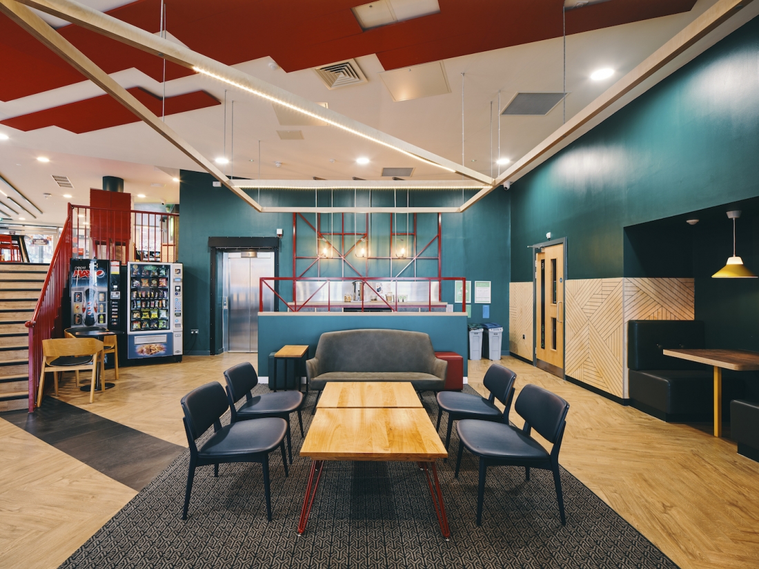 Huge-scale overhead ceiling rafts are in plywood with integrated lighting.