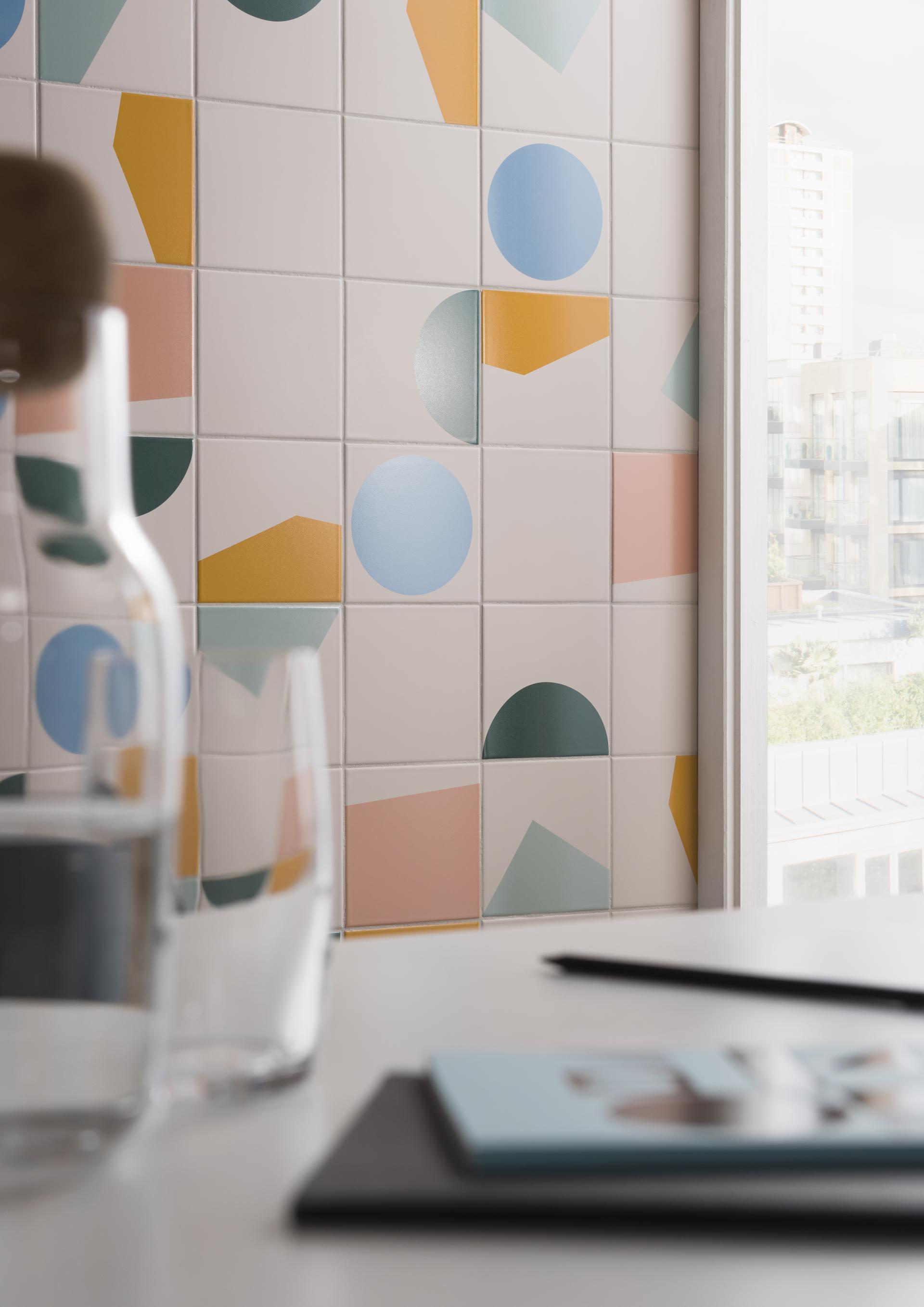 Contemporary Tom Pigeon tiles featuring geometric shapes and pastel colors displayed in Parkside's Clerkenwell studio.
