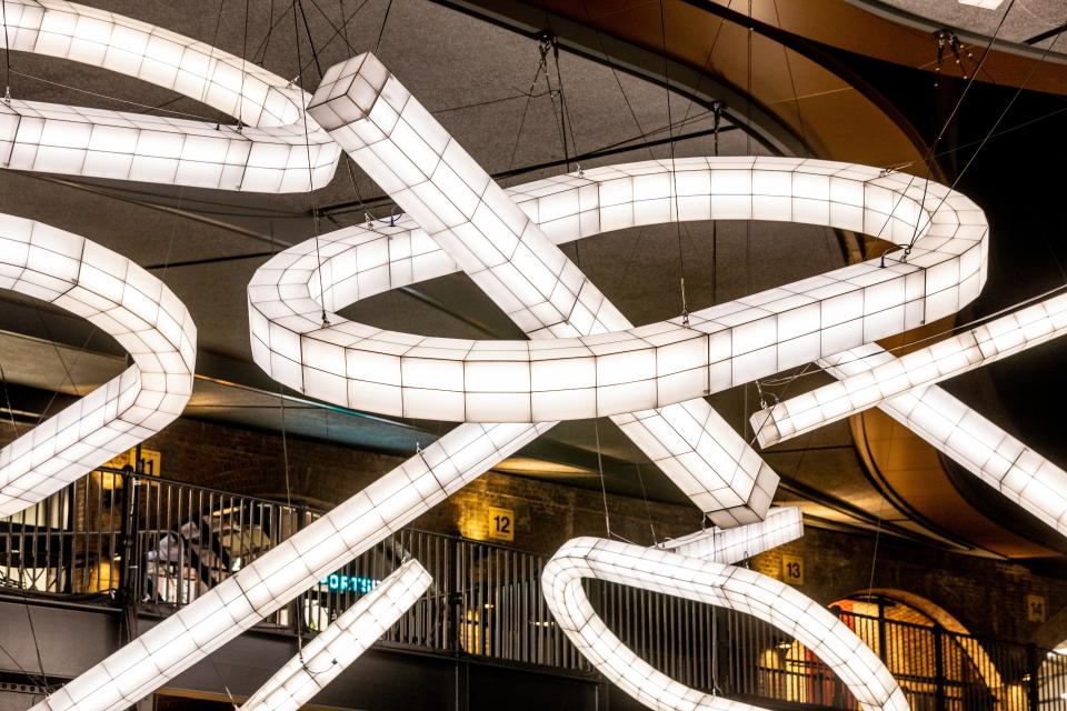 Giant sculptural lights by Studio Mieke Meijer, displaying innovative design and festive ambiance in Coal Drops Yard.