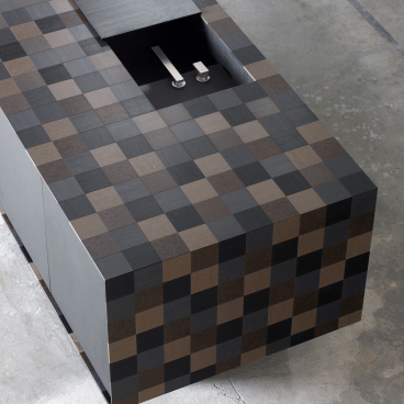 Modern countertop made of PaperStone® showcasing eco-friendly materials and a unique patchwork design.