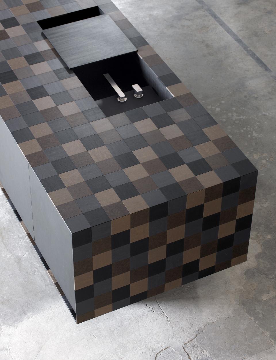 Modern countertop made of PaperStone® showcasing eco-friendly materials and a unique patchwork design.