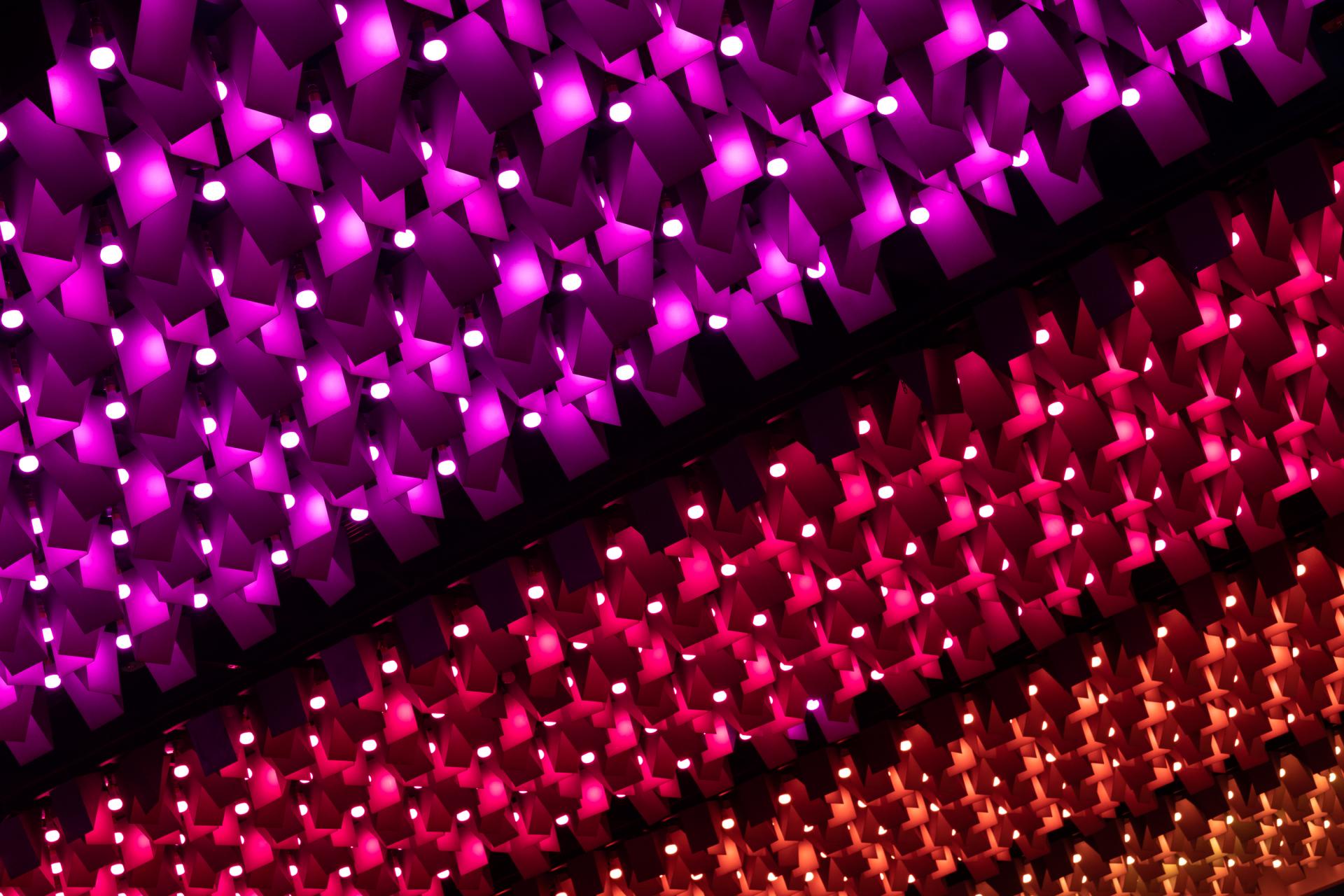 Colorful geometric lighting design enhances the atmosphere of New Century, a unique community venue.