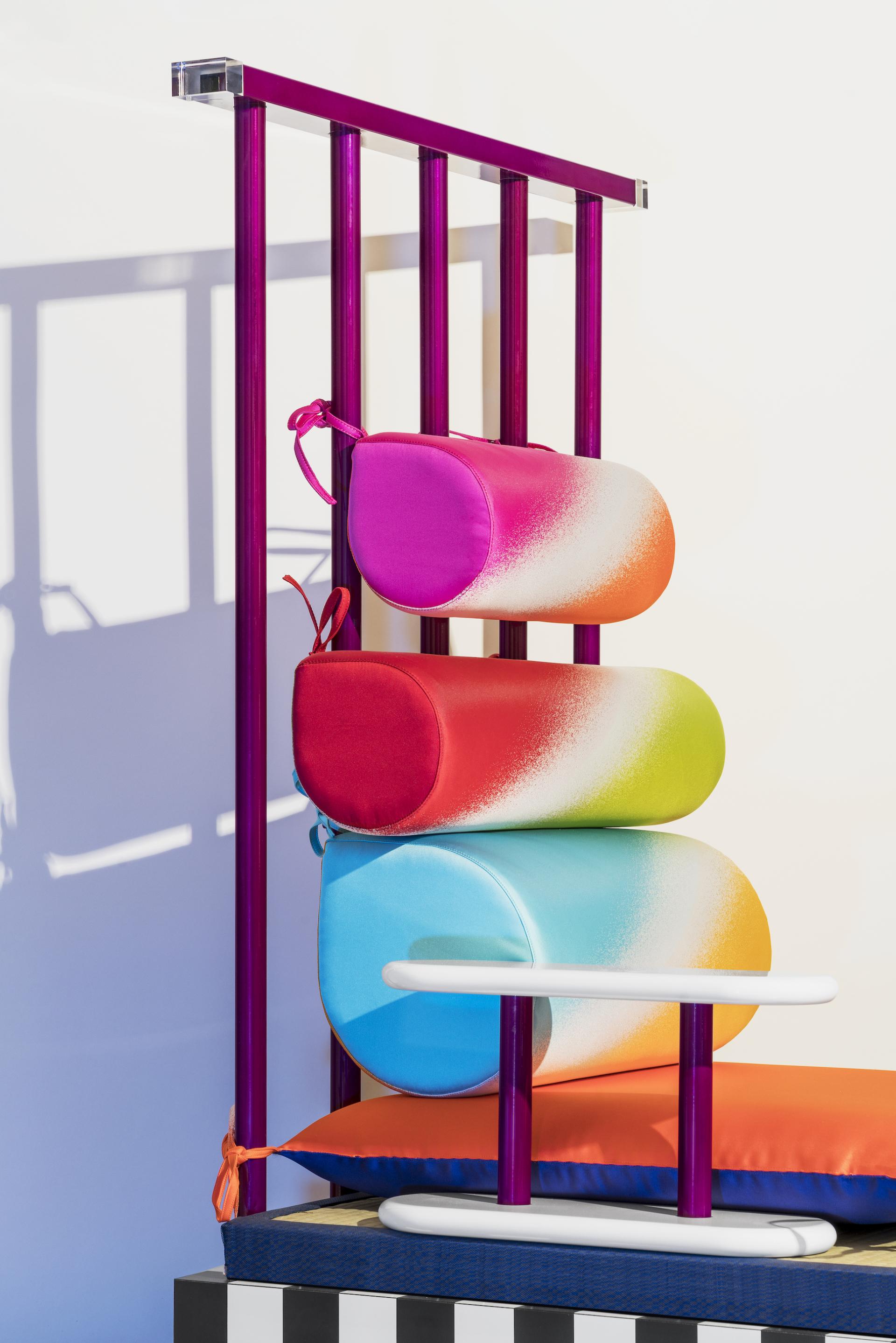 Colorful Memphis-inspired seating arrangement featuring layered cushions and vibrant support structure, embodying the Post Design aesthetic.