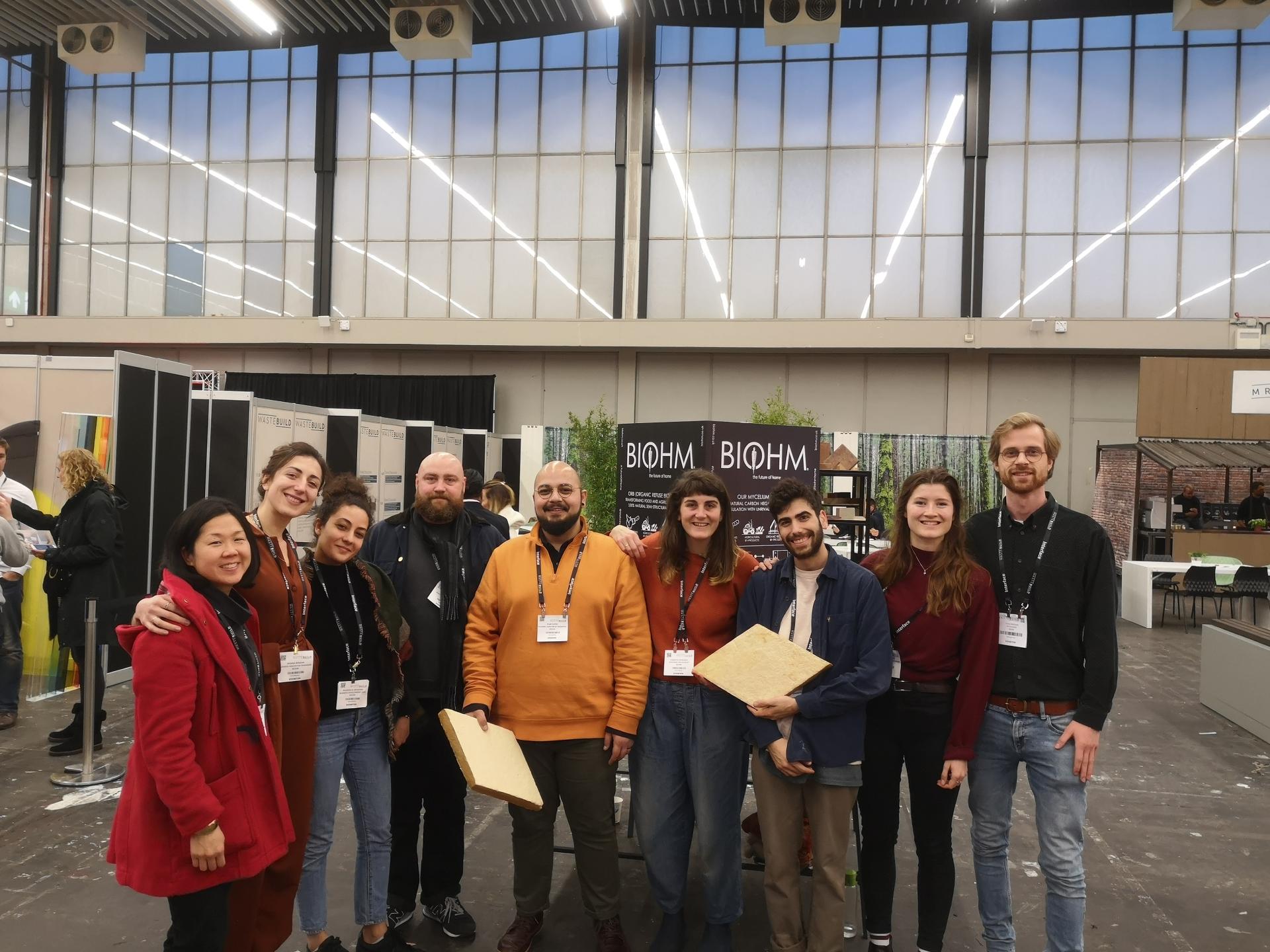BIOHM team members celebrating their equity crowdfunding campaign at an event, showcasing innovation in sustainable research and development.