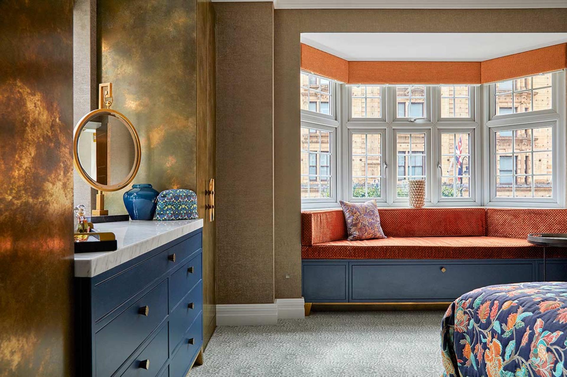 Modern Knightsbridge apartment interior featuring elegant design, a cozy window seat, and artistic decor inspired by Van Gogh.