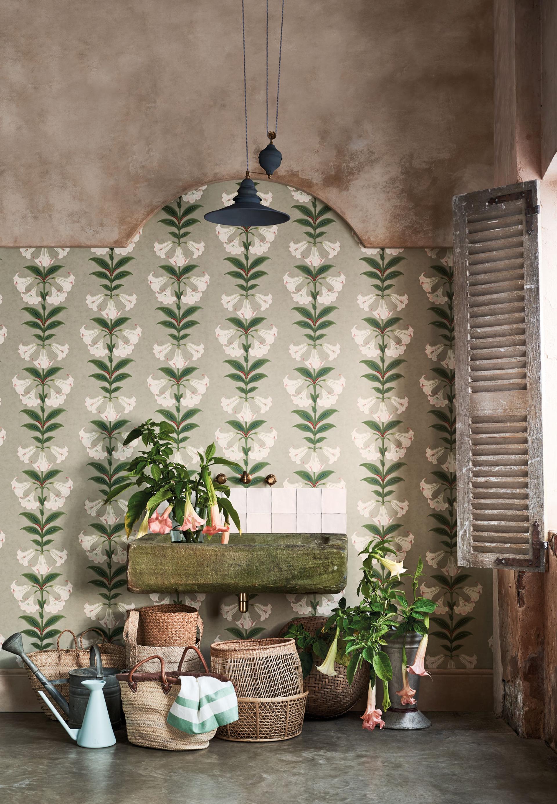 Elegant Seville wallpaper by Cole & Son, featuring floral patterns, rustic decor and greenery in a warm interior setting.