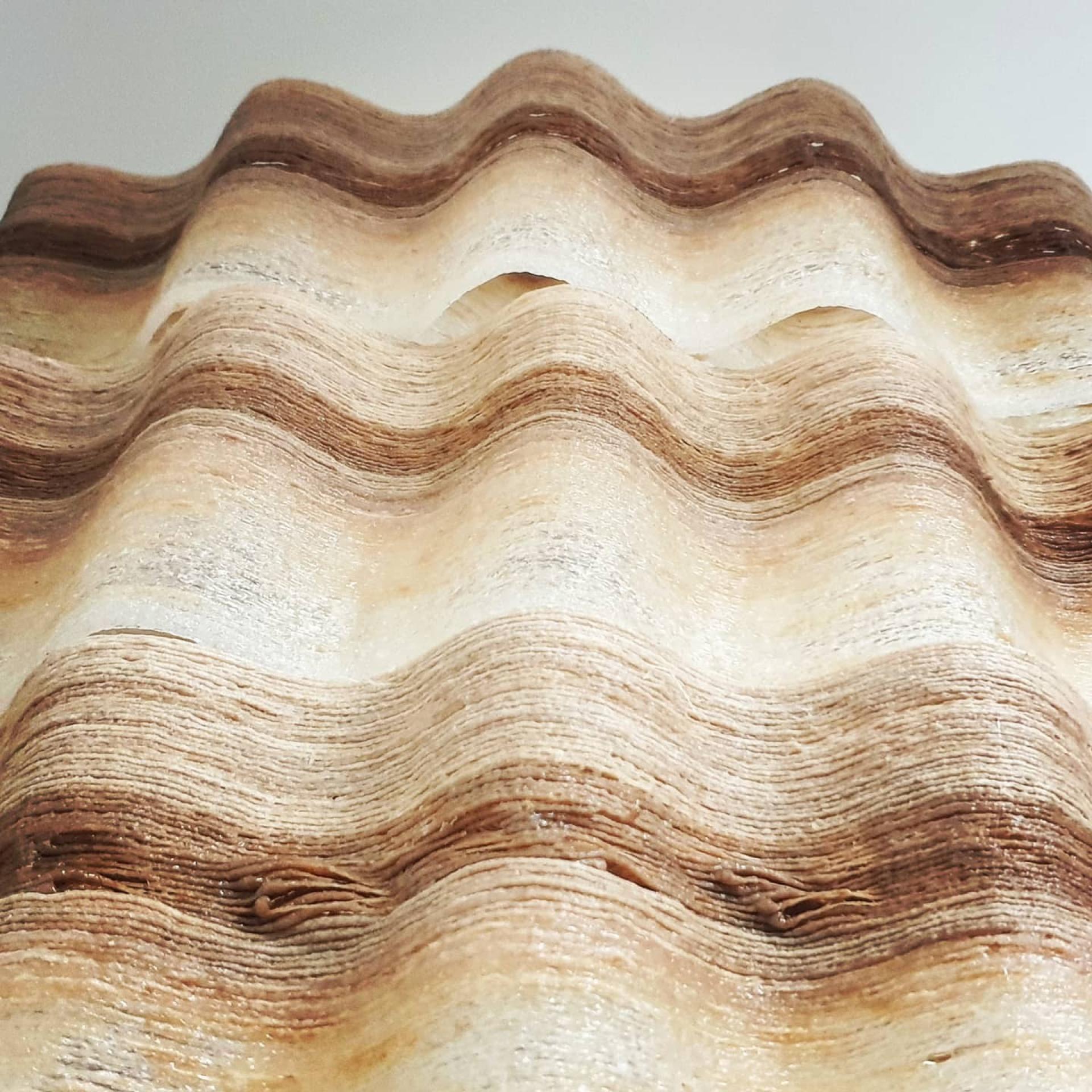 Wavy, textured sculpture featured in Anne Asensio and Arthur Mamou-Mani's installation at the Design Museum during COP26.