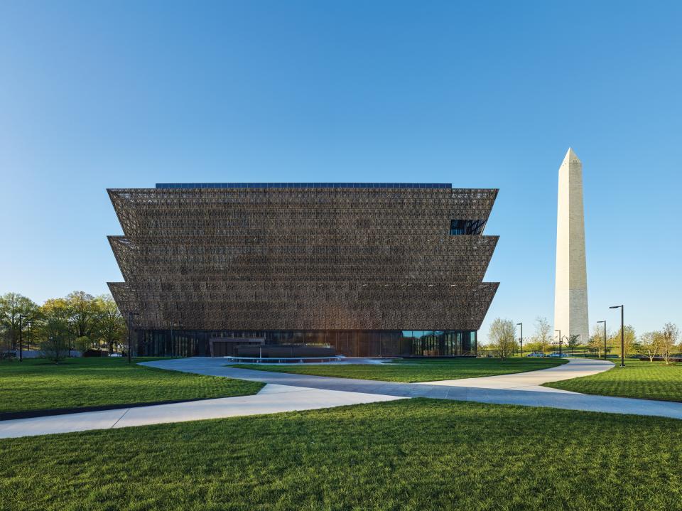 National Museum of African American History and Culture alongside the Washington Monument, showcasing modern architectural design and significant memorials.