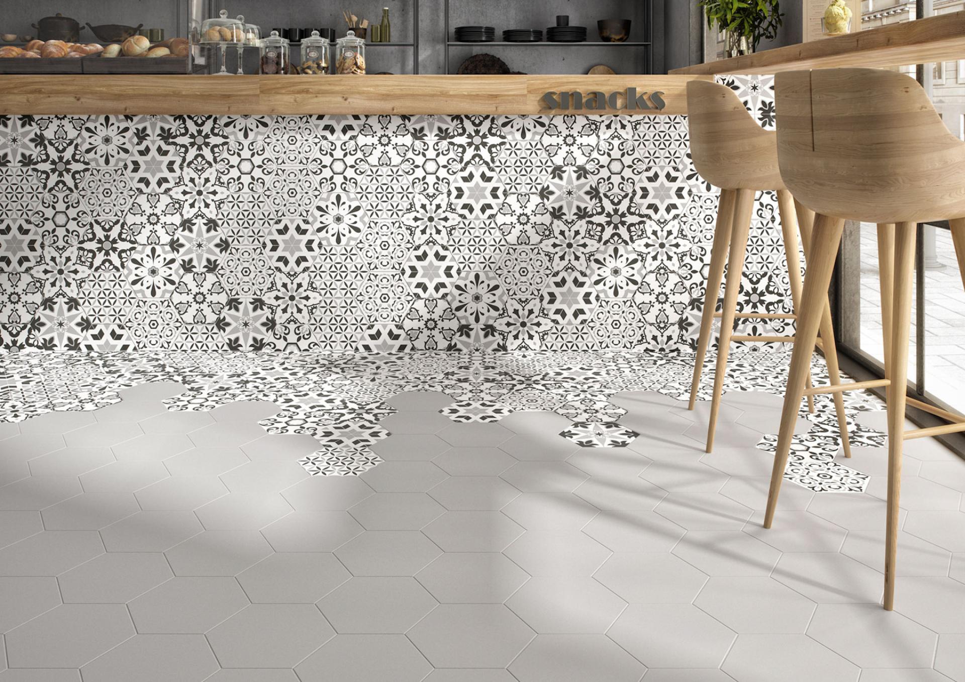 Stylish tiled flooring featuring intricate black and white patterns, showcasing innovative tile trends from the Tile of Spain.