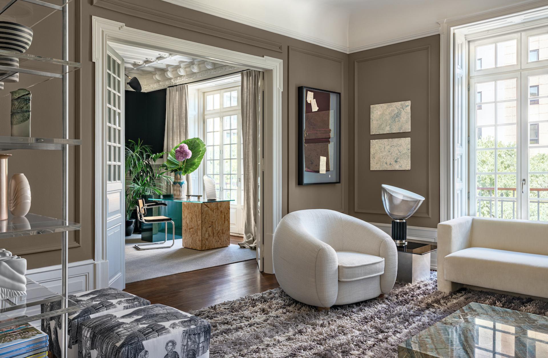 Elegant living room showcasing Cristina Jorge de Carvalho’s luxury furniture, including modern chairs and artistic decor elements.