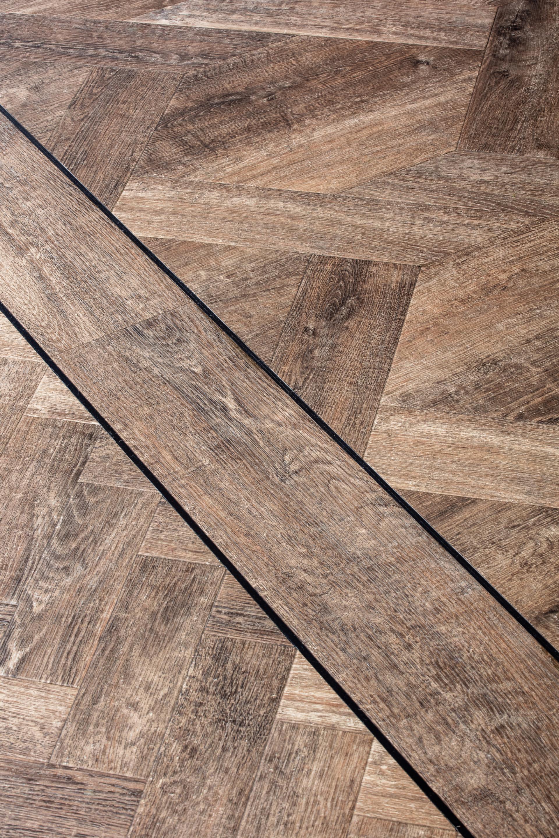 Stylish Amtico flooring featuring a contemporary herringbone pattern, enhancing the interior of the Dove Treehouse.