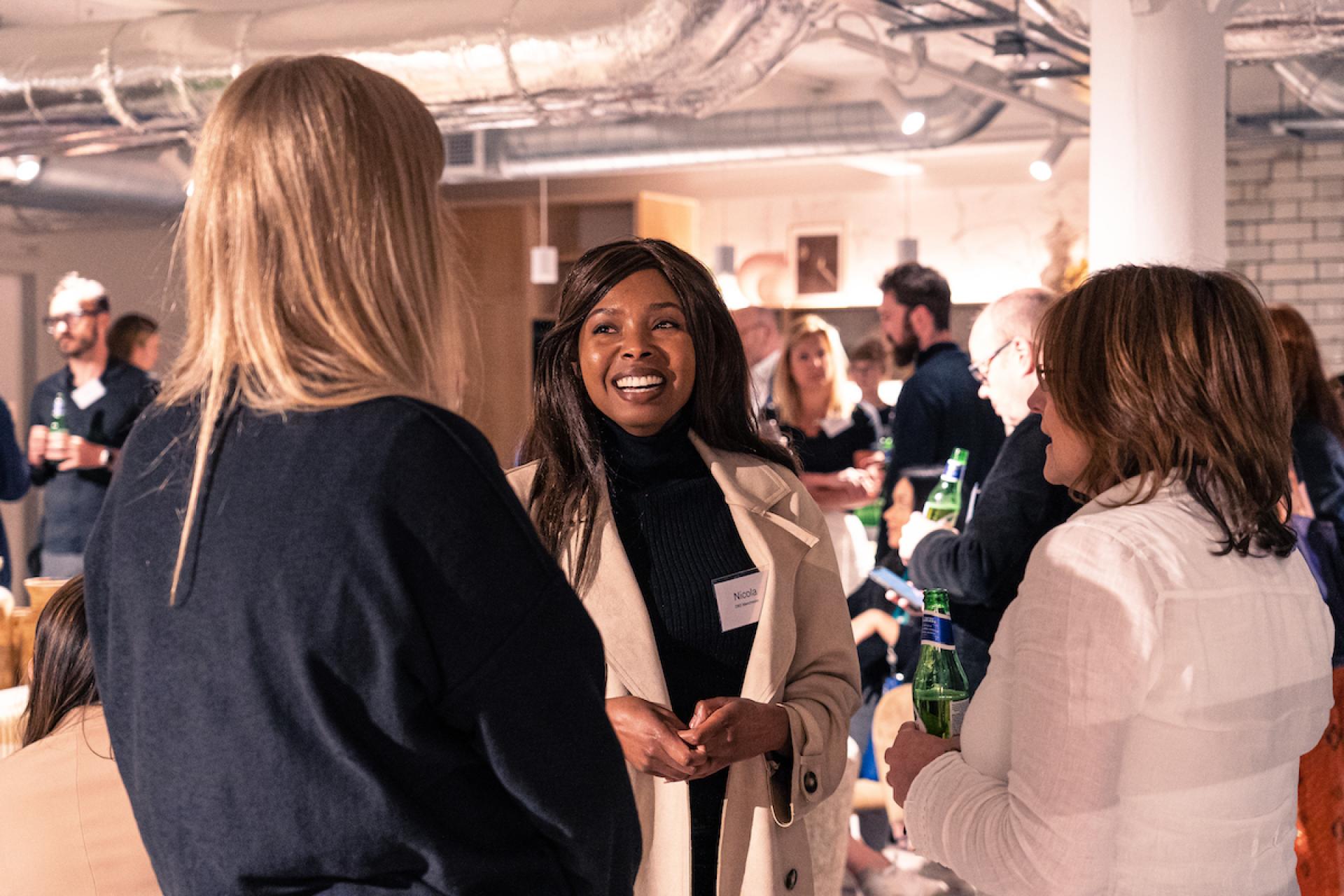 Networking event at Material Source Manchester, featuring engaged attendees discussing the local property outlook and industry insights.