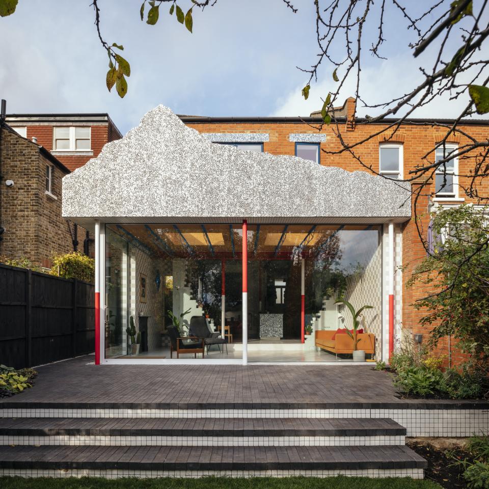 Colorful Edwardian semi-detached house transformed by CAN, featuring a striking mountain-inspired roof and modern outdoor space.
