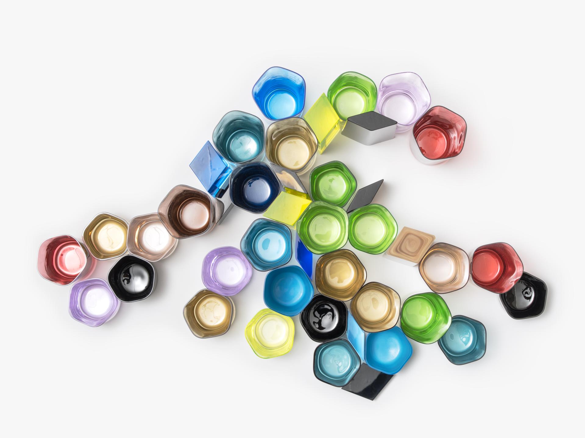 Colorful glass vessels in various shapes and sizes, showcasing Bocci's innovative design and commitment to craft.