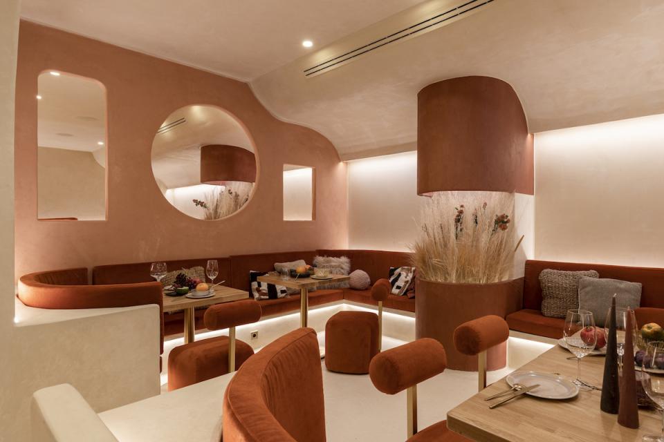 Elegant dining space in Living Bakkali, featuring Middle Eastern-inspired design with warm tones and unique furnishings.