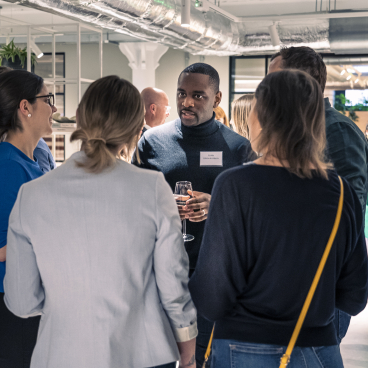 Attendees engage in discussion during the Future of Residential seminar, showcasing collaboration in innovative residential design.