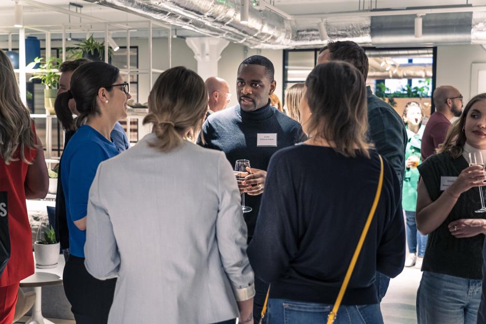 Attendees engage in discussion during the Future of Residential seminar, showcasing collaboration in innovative residential design.