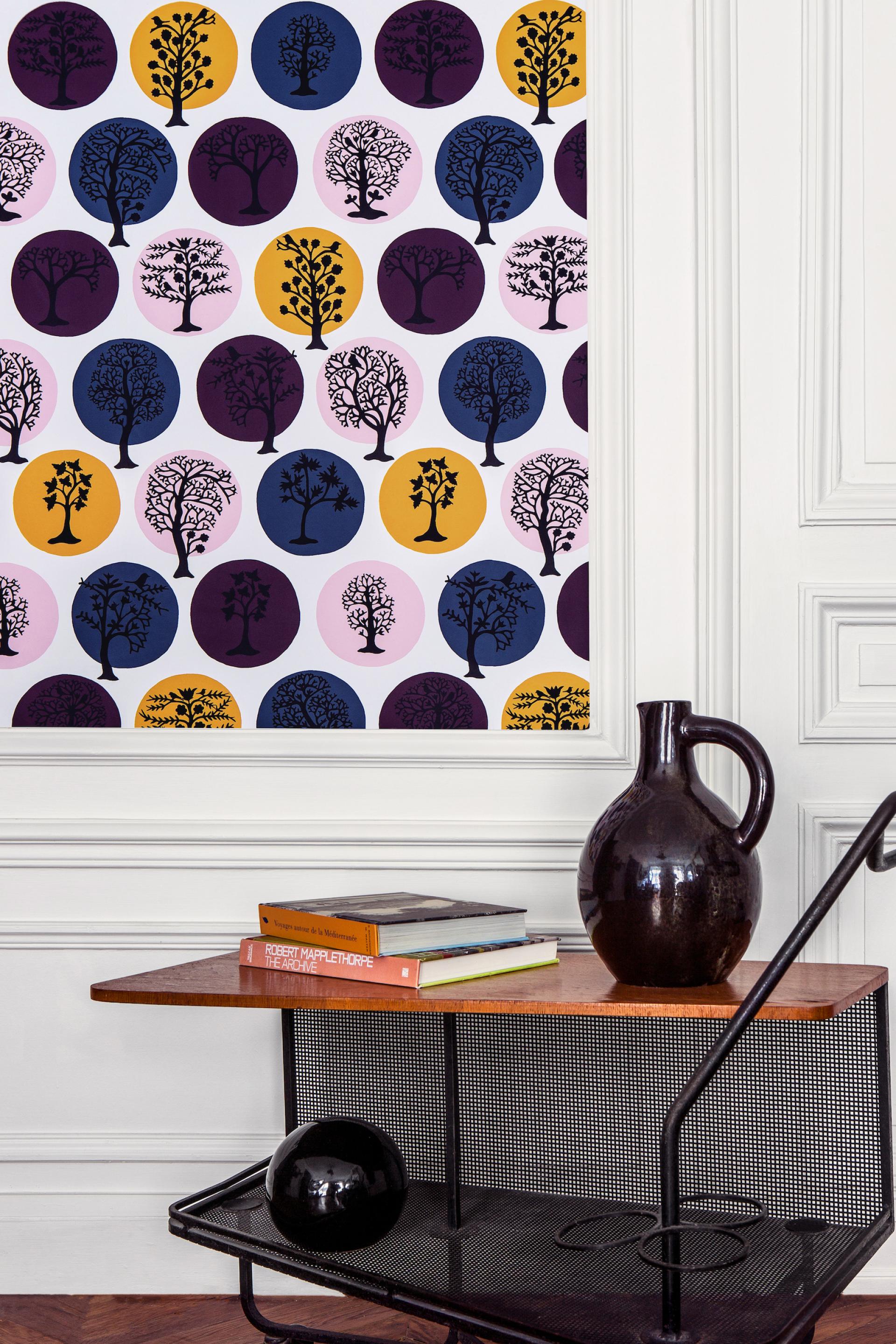 Colorful capsule wallpaper featuring playful tree designs by Sacha Walckhoff, enhancing contemporary interior decor.