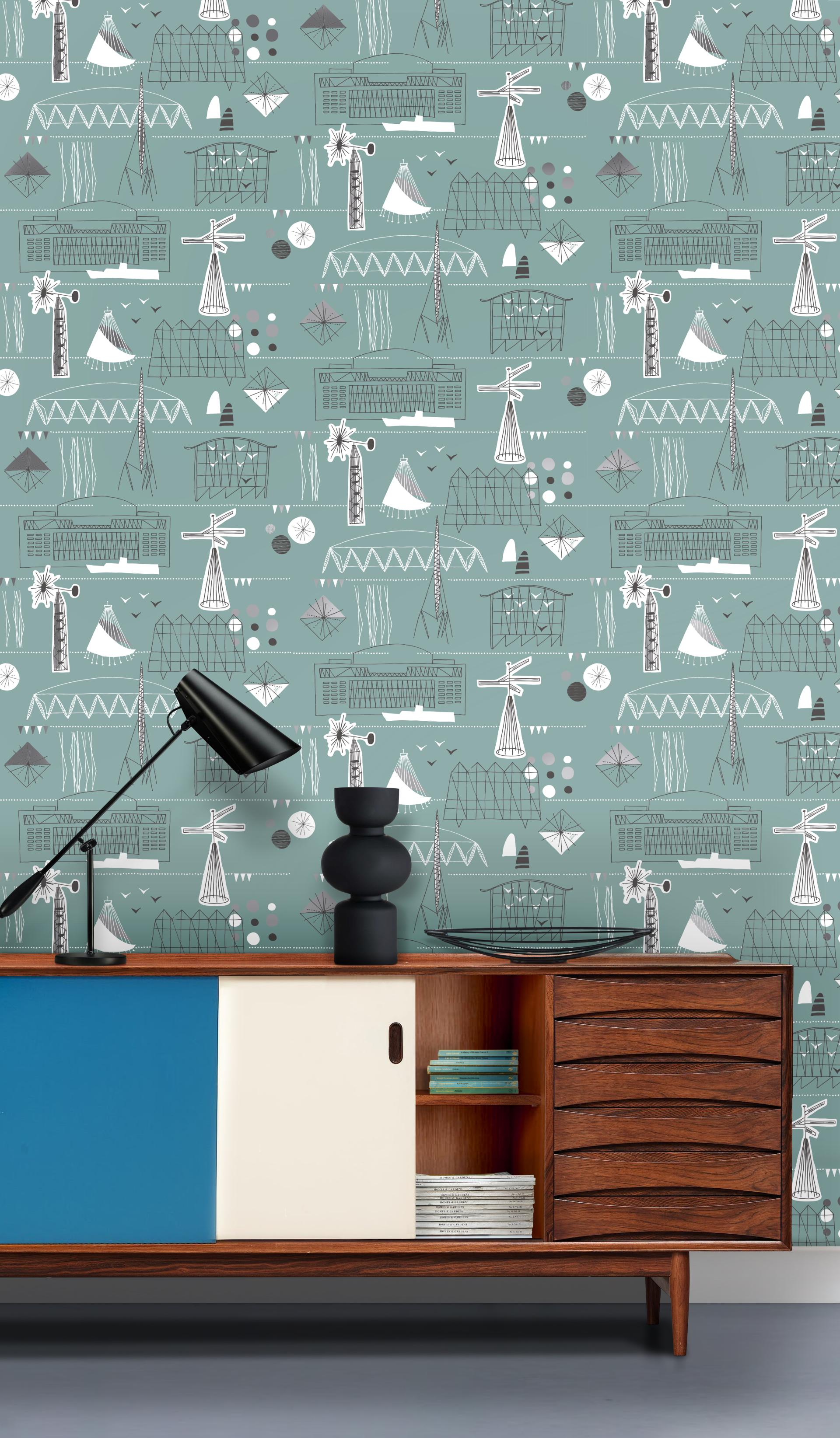 Nautical-themed Whitby wallpaper featuring playful coastal designs, complementing a mid-century modern cabinet and lamp.