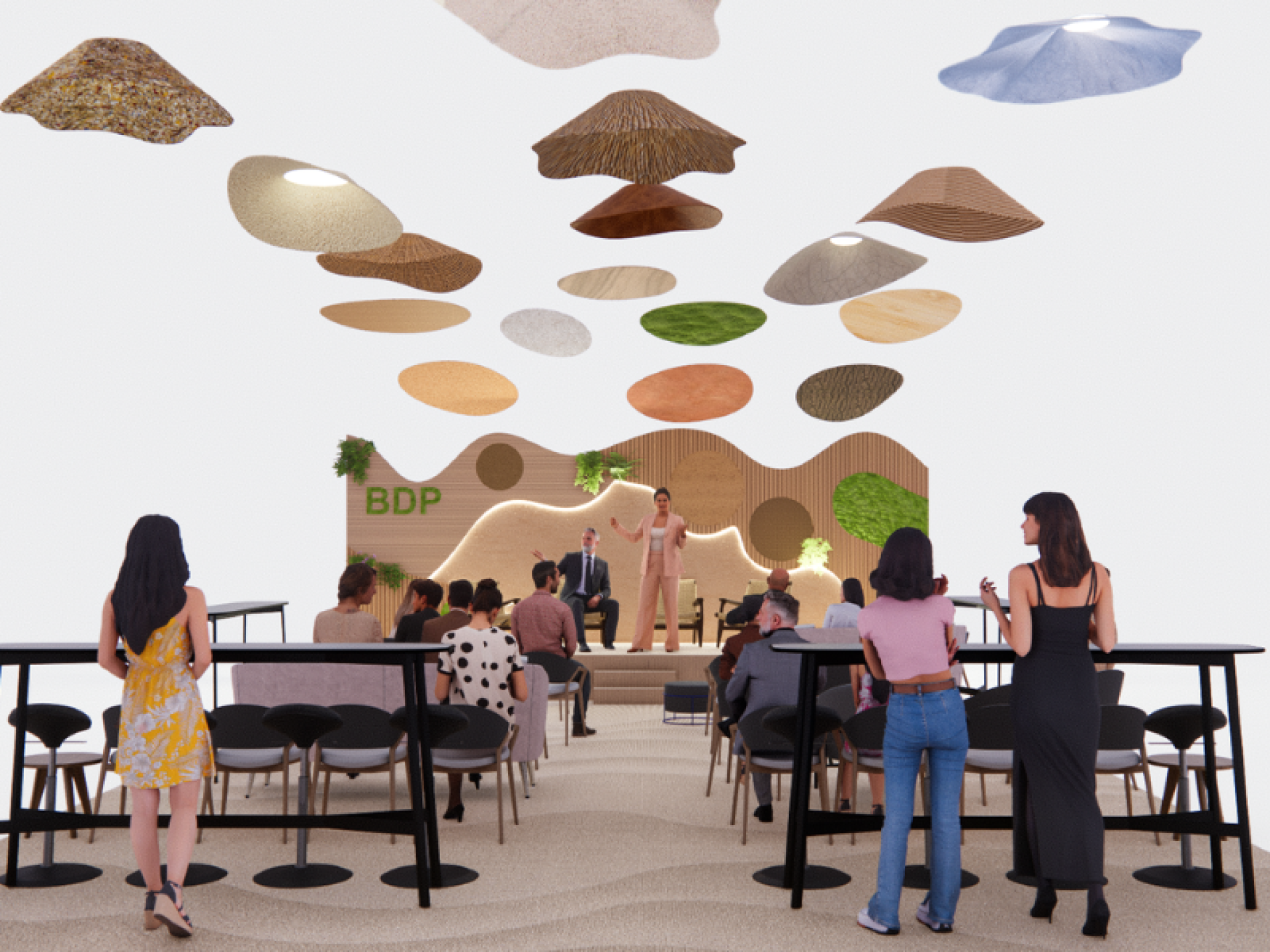 Audience engaged at the Workspace Design Show featuring innovative design elements and a speaker at the BDP stage.