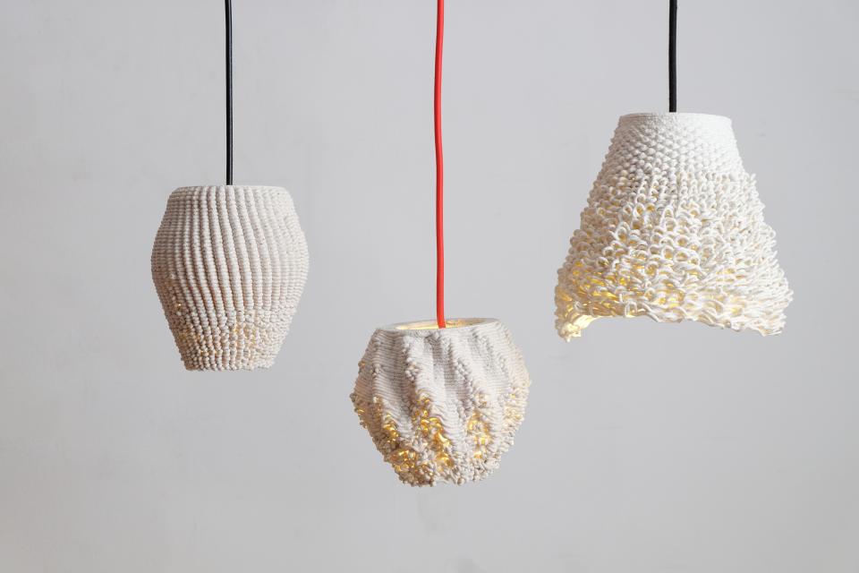 Three uniquely designed 3D printed lamps made from recycled ceramics, showcasing sustainable and parametric design elements.