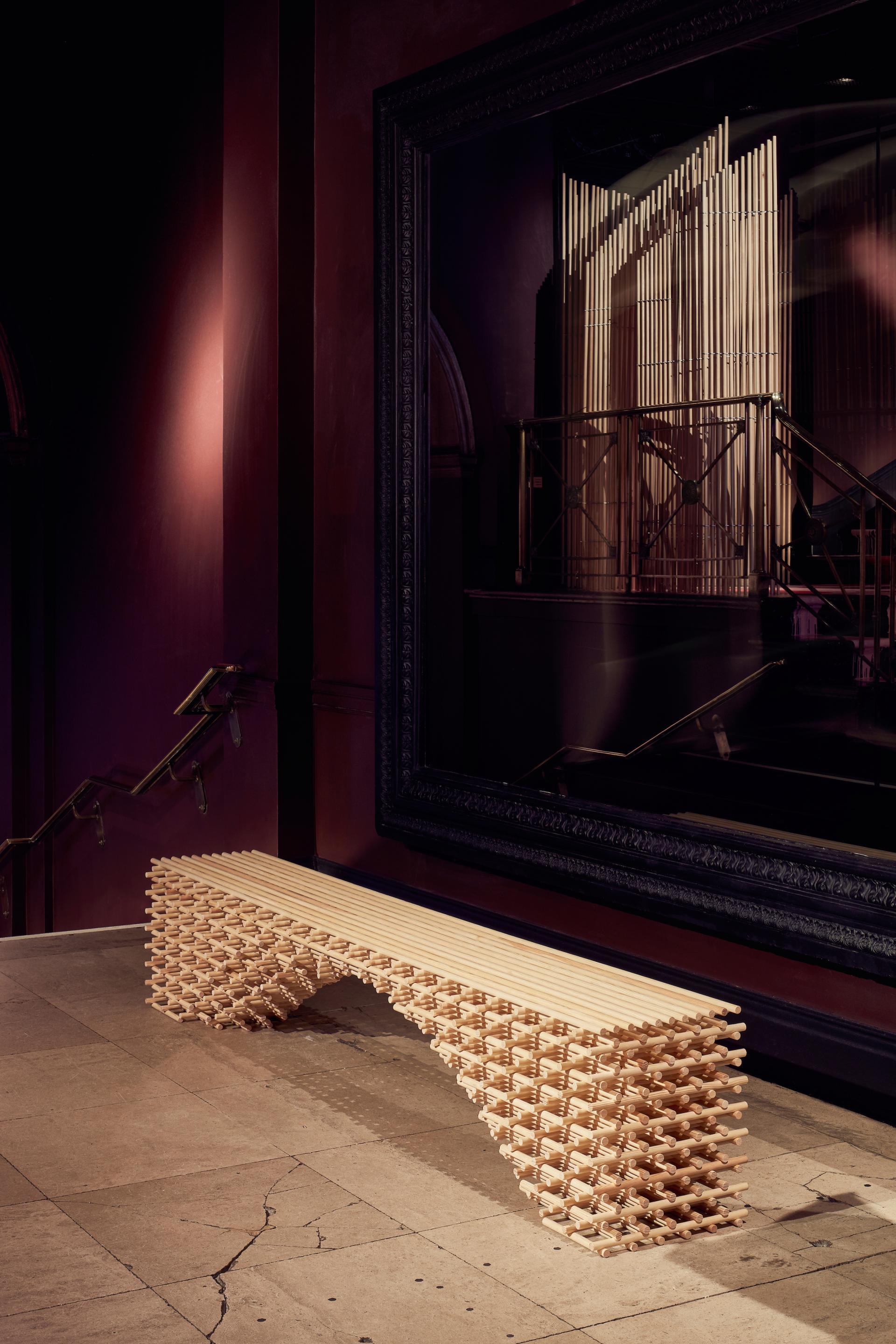 Innovative wooden bench design showcased at A Second Life exhibition by Matter of Stuff in a stylish interior setting.