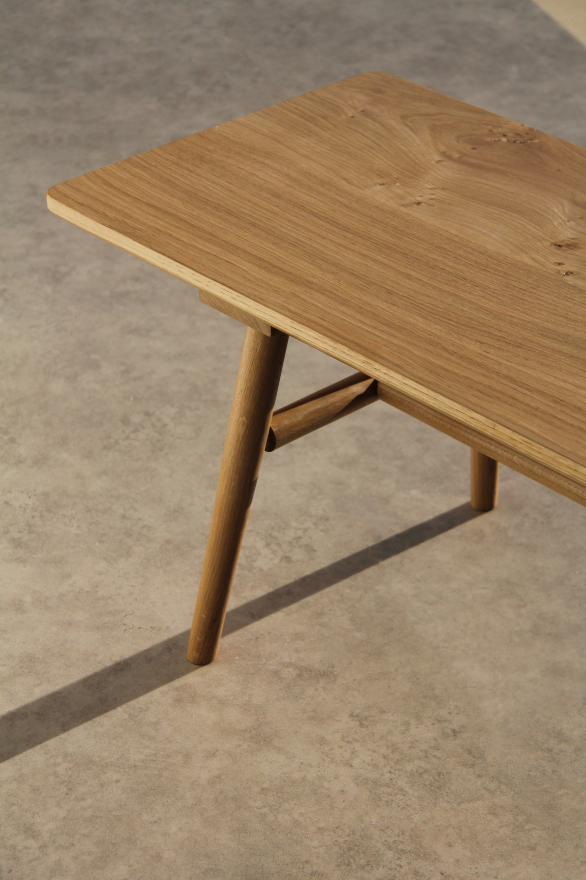 Elegant wooden table with tapered legs, showcasing craftsmanship by maker-in-residence Jesse Cracknell at NOMA.