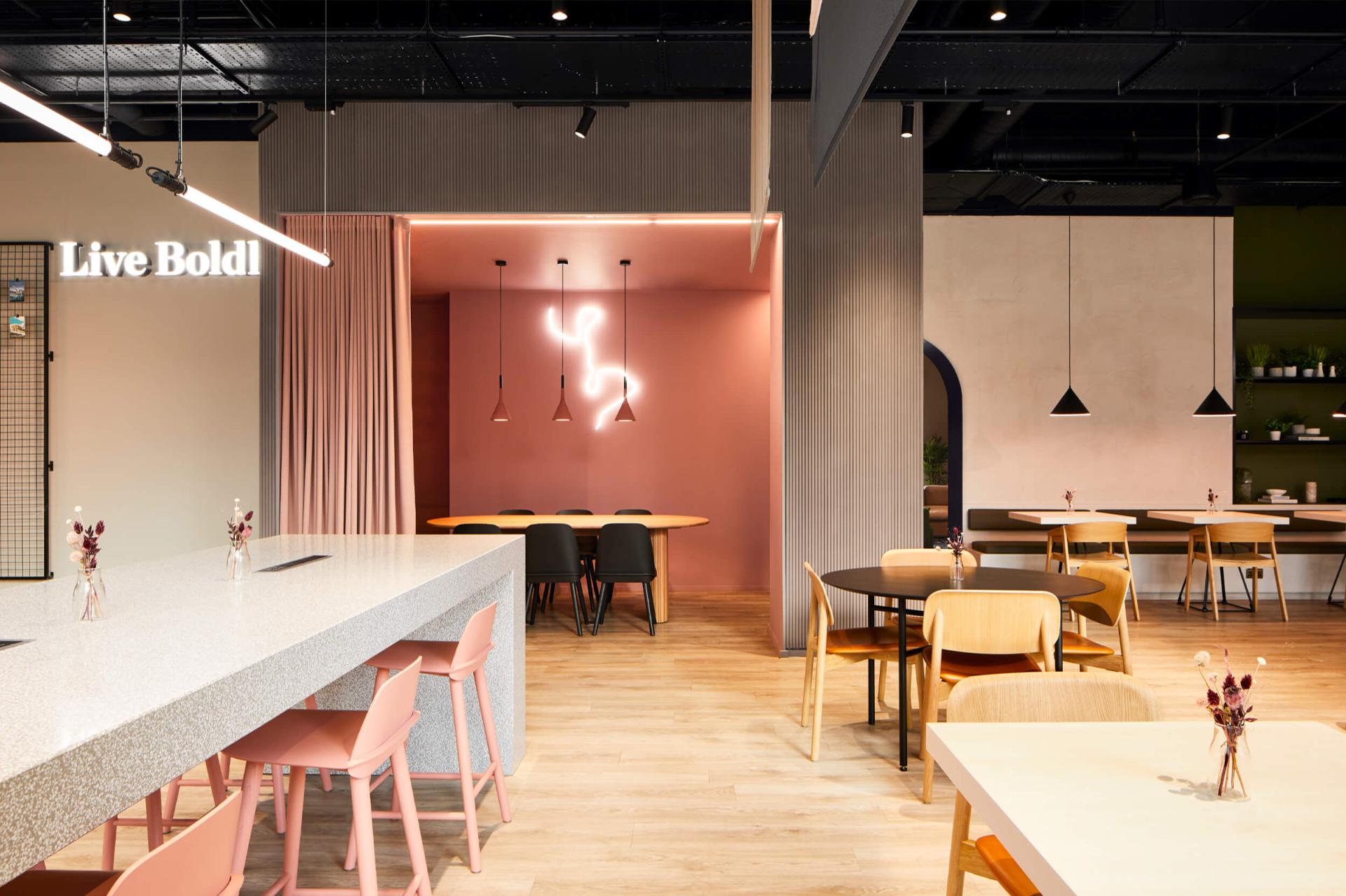 Elegant interior design of a modern café featuring stylish chairs, a sparkling countertop, and warm lighting accents.