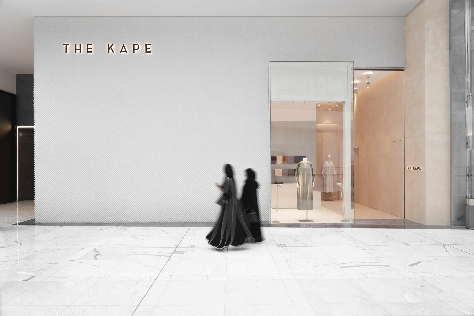 Elegant storefront of THE KAPE in Dubai, showcasing modest women's fashion with stylish garments and modern design.